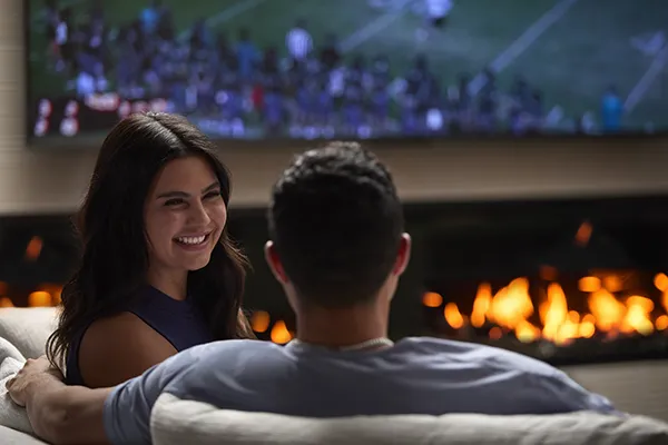 The Astrie residents relaxing by the fireplace in the sports lounge