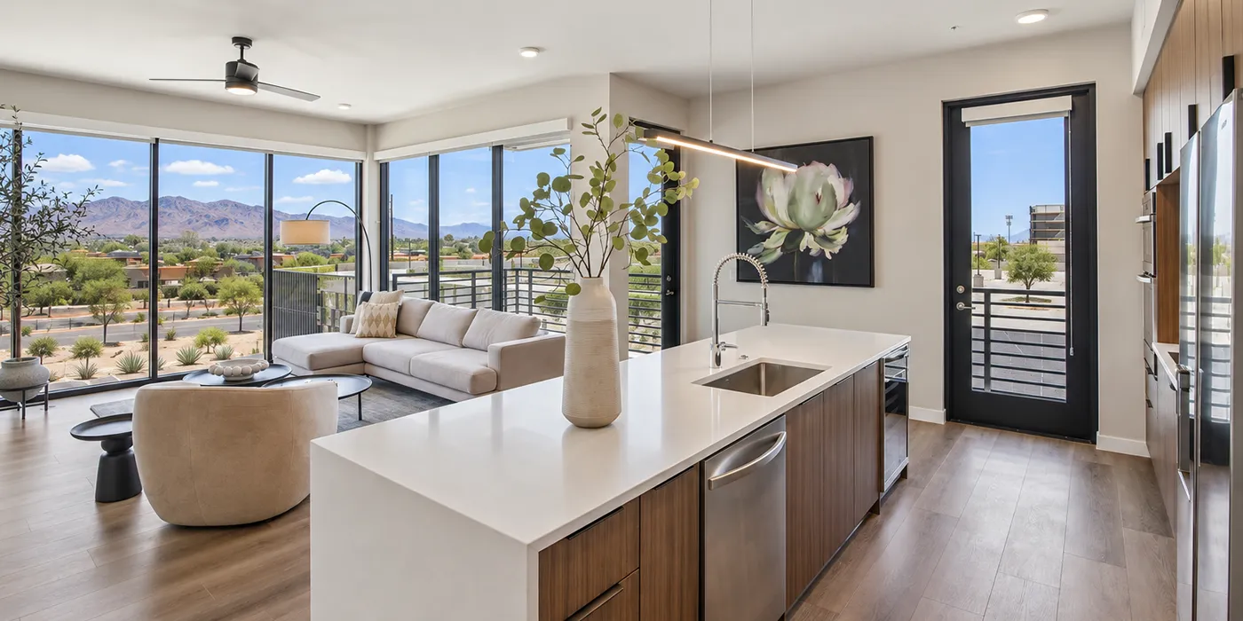 Contemporary kitchen at The Astrie with quartz island, natural light, and Tucson mountain views