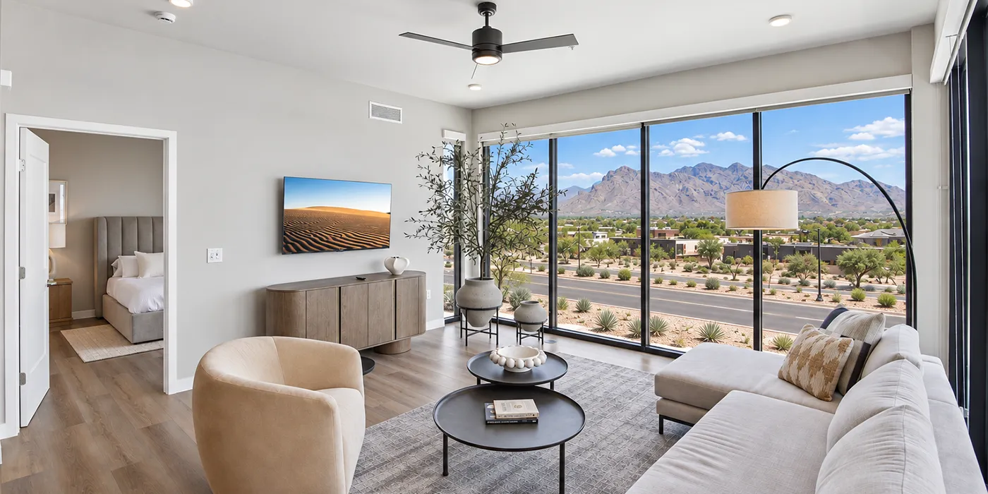 Modern living room at The Astrie with expansive windows and Tucson mountain views