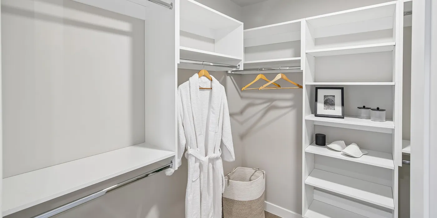 Oversized closet at The Astrie with custom closet organizers and built-in shelving